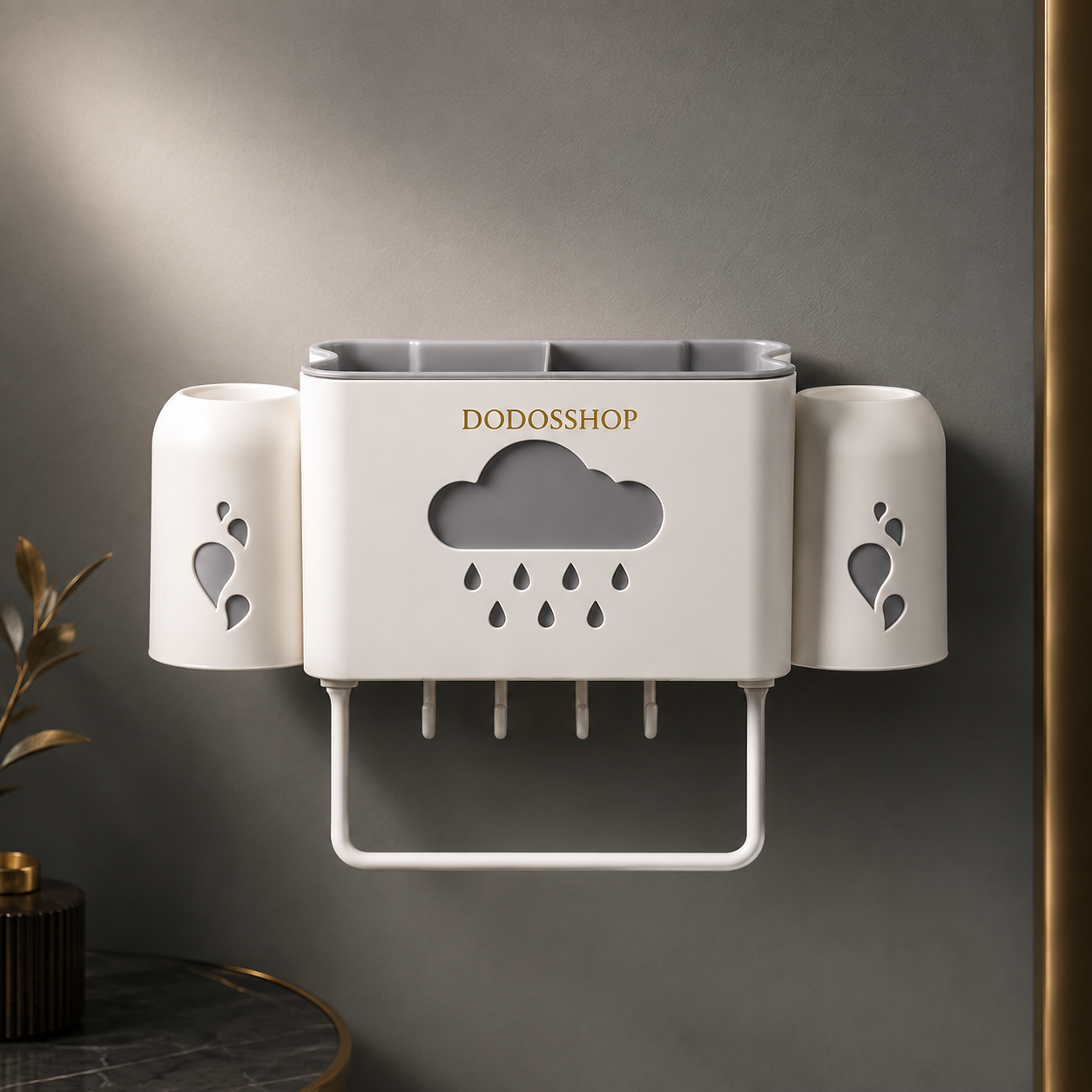 Bathroom Storage Rack
A wall-mounted toothbrush holder and cup organizer by DODOShop, shown in a clean bathroom setting against a dark gray wall. The product is primarily white with a gold brand name printed on the front, a cloud-shaped cutout with rain details, and two side cups.