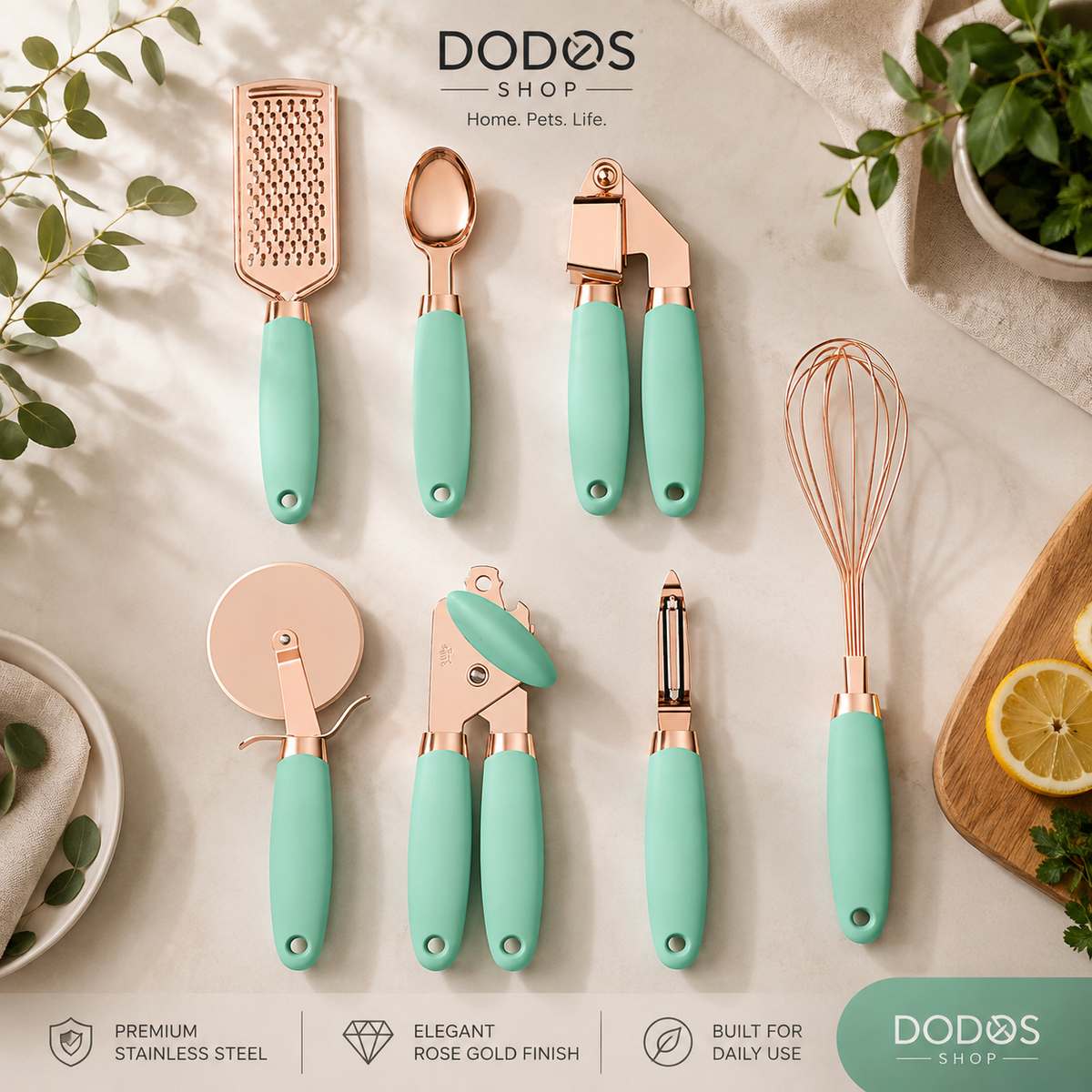 Elegant Stainless Steel Kitchen Tool Set
A set of nine kitchen utensils with mint green handles and rose gold metal heads, arranged on a light beige marble surface with decorative greenery, a lemon slice, and a cloth. The brand name 'DODOS SHOP' is visible at the top and bottom of the image.