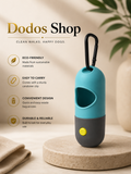 LED Waste Bag Dispenser
A pet waste bag dispenser by Dodos Shop, featuring a teal and dark gray body with a yellow button and a black carabiner clip. The product is displayed on a beige stone pedestal with promotional text highlighting its eco-friendly, easy-to-carry, convenient, and durable design.
