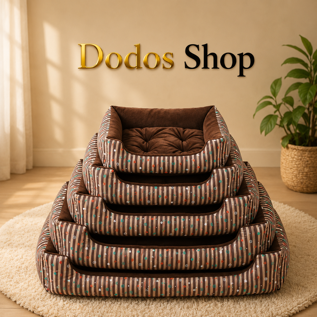 Five nested rectangular pet beds with striped brown, beige, and teal fabric and a tufted brown cushion inside each bed, stacked on a cream rug in a warm room. The words 'Dodos Shop' appear above the beds.
