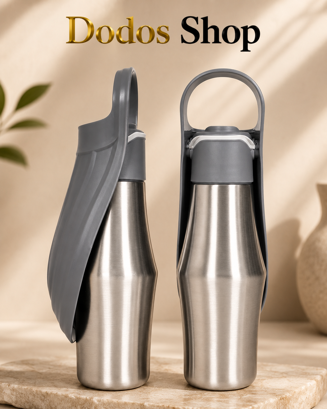 Two stainless steel water bottles with gray flip-top lids and carrying loops, displayed on a stone surface with a warm beige background and the text 'Dodos Shop' at the top.